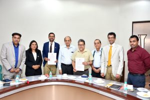 While Exchanging MoU at Graphic Era University