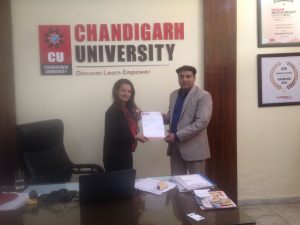 While exchanging MoU's at Chandigarh University